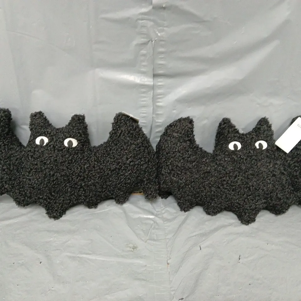 PAIR OF BAT SHAPED CUSHIONS IN BLACK