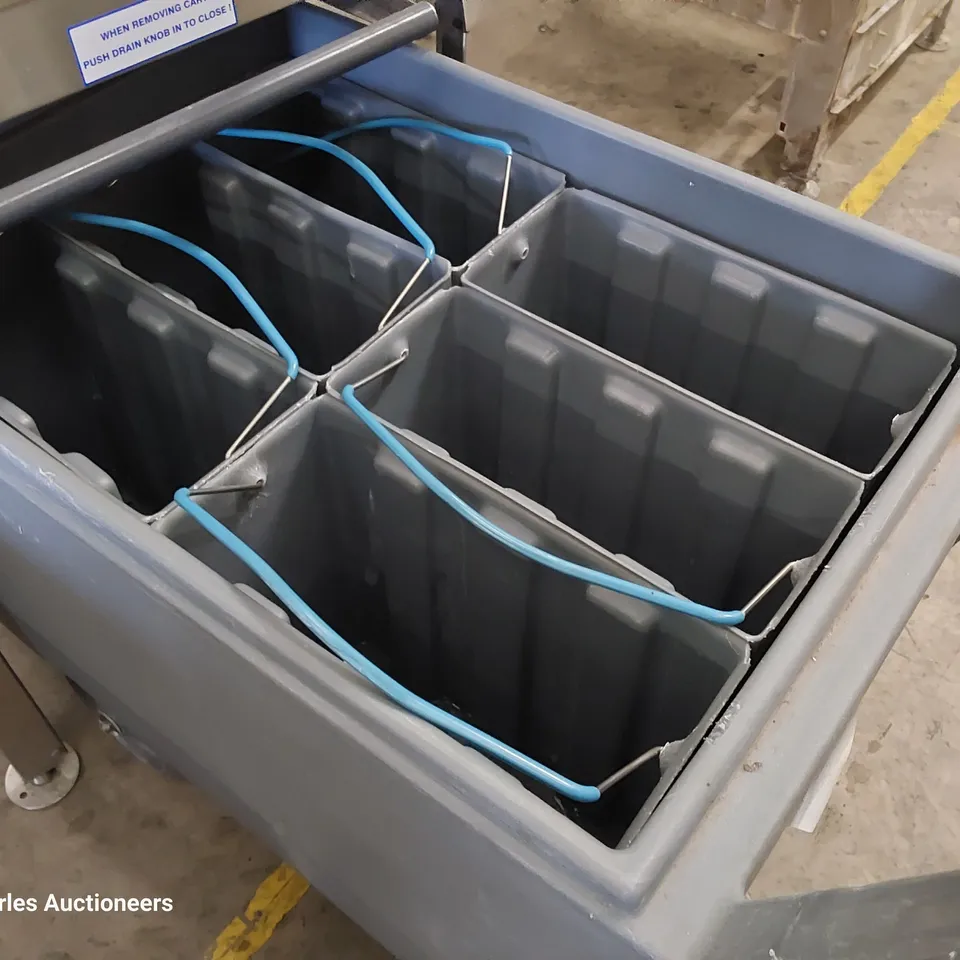 FOLLETT COMMERCIAL ICE MACHINE ON STAND WITH ICE TROLLEY