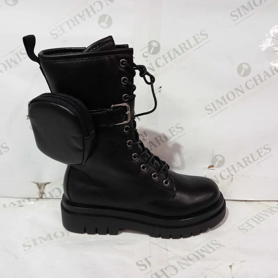 BOXED PAIR OF PRETTY LITTLE THING LEATHER BOOTS IN BLACK UK SIZE 4