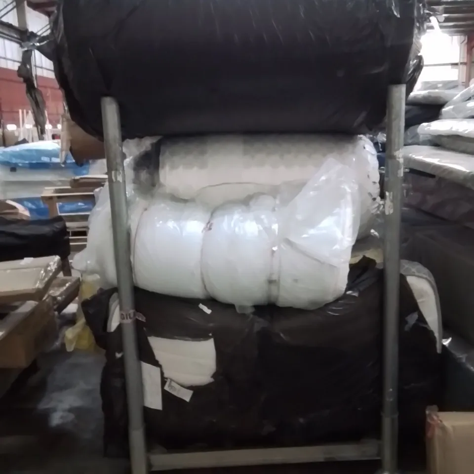 CAGE CONTAINING LARGE QUANTITY OF ROLLED MATTRESSES 