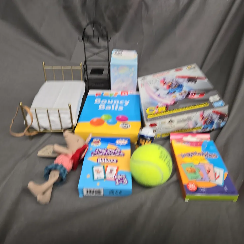 APPROXIMATELY 10 ASSORTED TOYS AND GAMES TO INCLUDE TENNIS BALLS, CARD GAMES AND BOUNCY BALLS