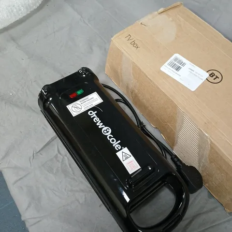 DREW & COLE ELECTRIC APPLIANCE β BLACK HANDHELD UNIT WITH DUAL OVAL HEATING SURFACES .