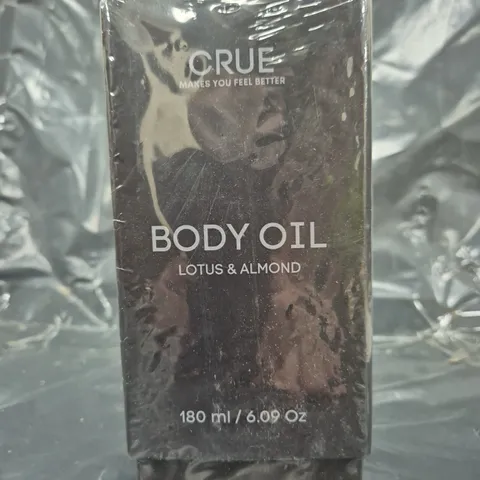 BOX OF APPROXIMATELY 16 SEALED CRUE LOTUS & ALMOND BODY OIL (180ML)
