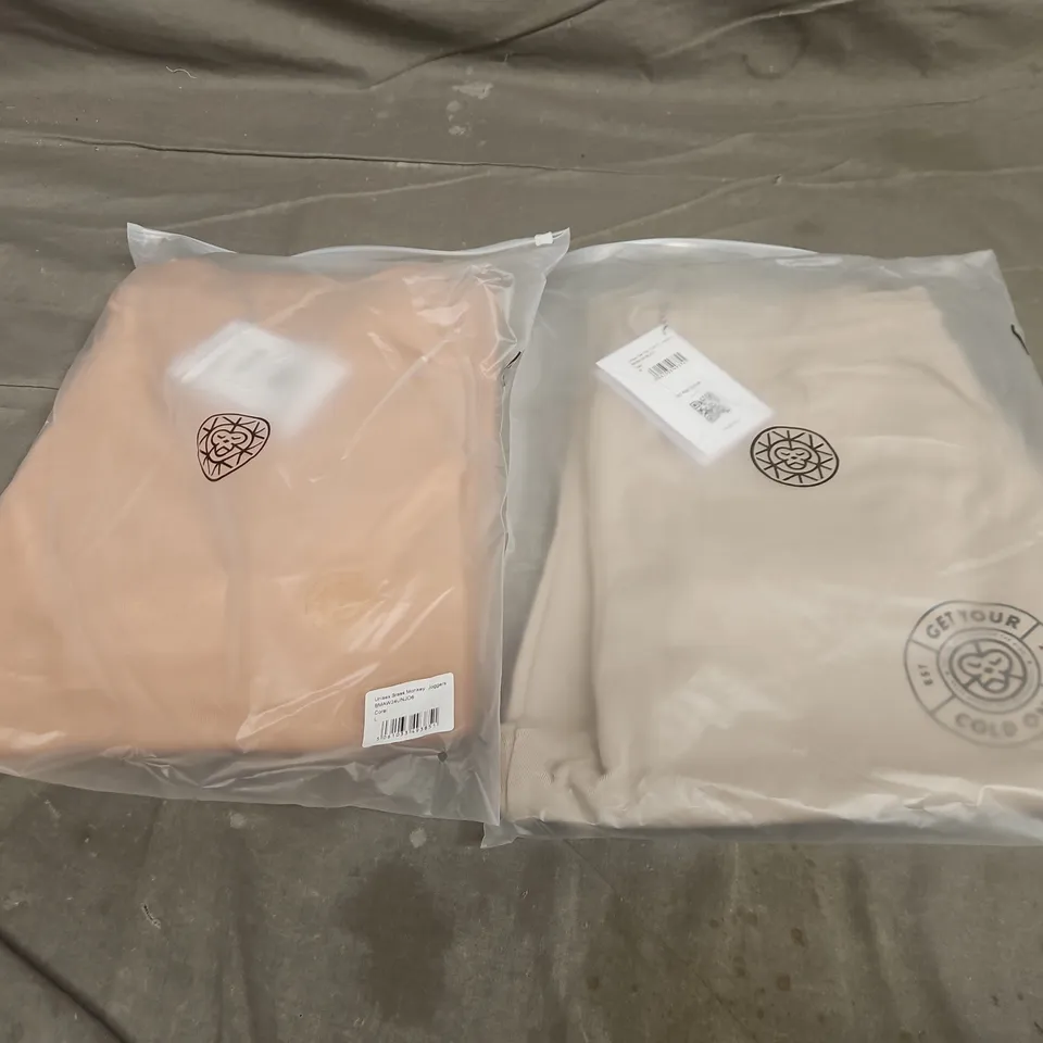 APPROXIMATELY 21 ASSORTED BAGGED CLOTHING ITEMS IN VARIOUS SIZES TO INCLUDE UNISEX GET YOUR COLD ON JOGGERS IN CLAY & UNISEX BRASS MONKEY JOGGERS IN CORAL