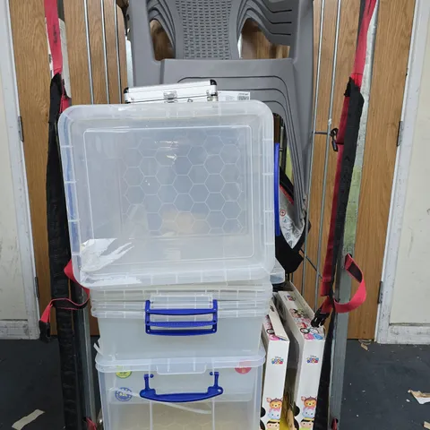 CAGE OF APPROXIMATELY 5 ASSORTED HOUSEHOLD ITEMS TO INCLUDE CLEAR PLASTIC STORAGE TUBS, WALL CLOCKS, GREY STACKING CHAIRS, ETC - COLLECTION ONLY