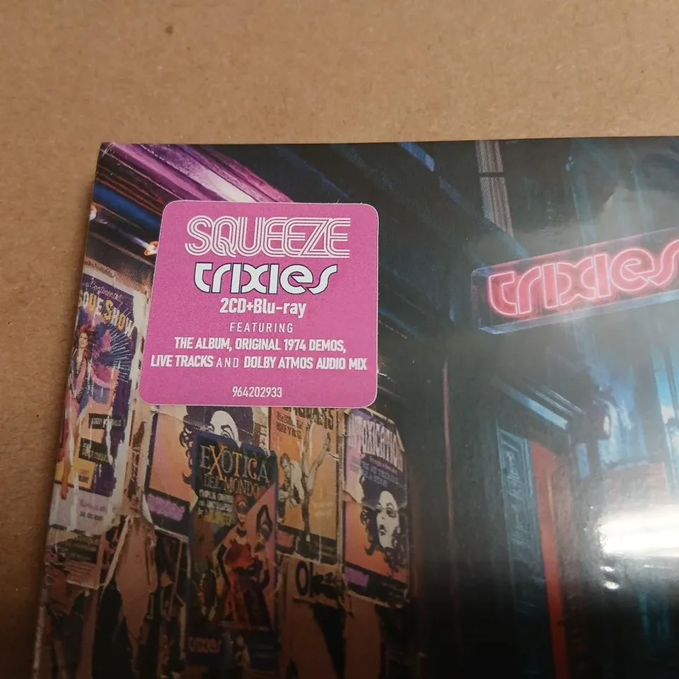 SQUEEZE – TRIXIES ALBUM BUNDLE TO INCLUDE; TRANSPARENT PINK VINYL, 2CD + BLU-RAY, TRIXIES SINGLE ON VINYL, GLEN TILBROOK SIGNED TRIXIES CONCOCTIONS MENU MERCHANDISE