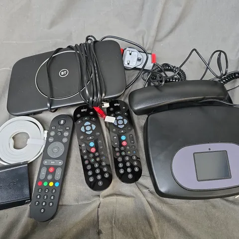 APPROXIMATELY 12 ASSORTED HOUSEHOLD ITEMS TO INCLUDE CABLES, ROUTERS, TV REMOTES, ETC