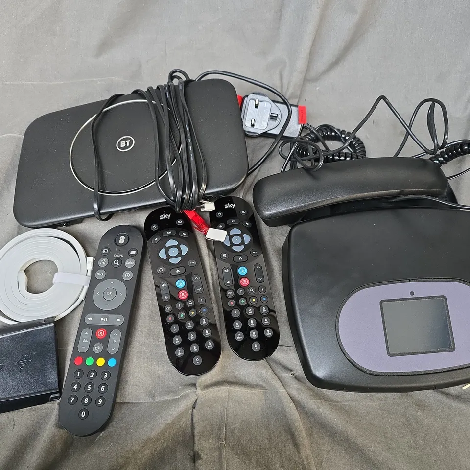 APPROXIMATELY 12 ASSORTED HOUSEHOLD ITEMS TO INCLUDE CABLES, ROUTERS, TV REMOTES, ETC