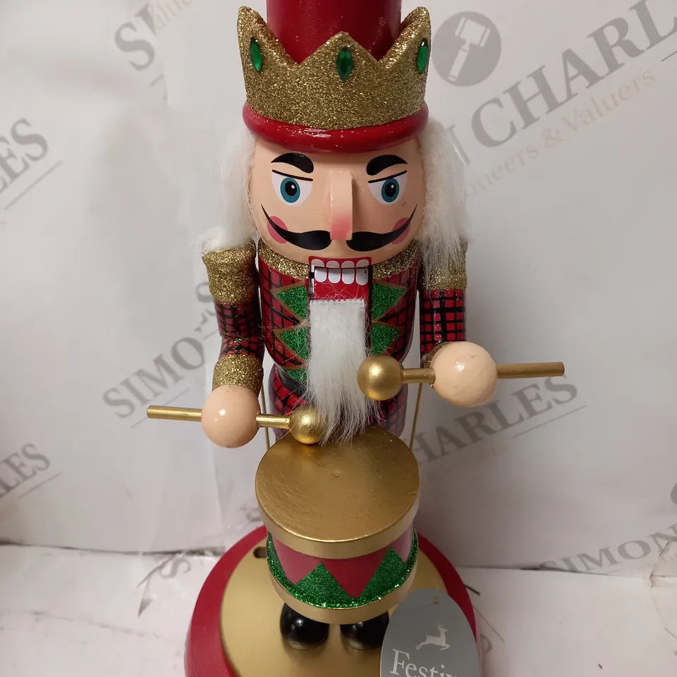 FESTIVE 32CM WOODEN ANIMATED MUSICAL NUTCRACKER