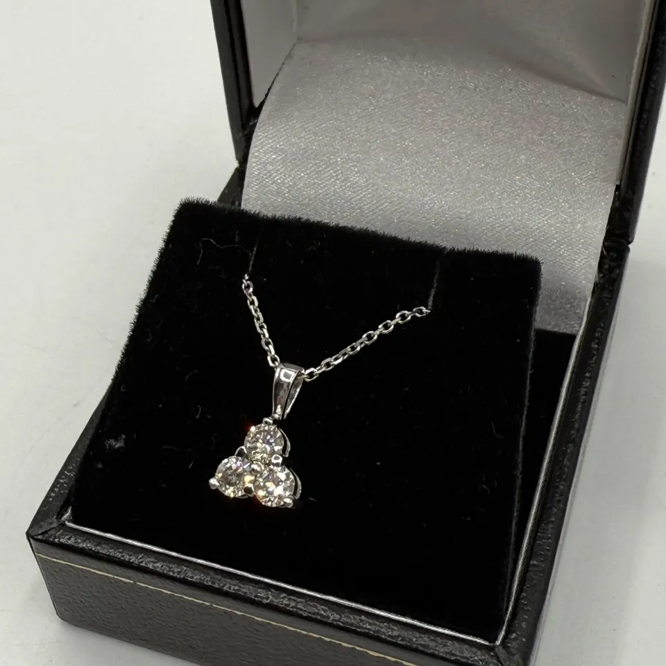 18CT WHITE GOLD TREFOIL PENDANT ON CHAIN, SET WITH A NATURAL DIAMOND