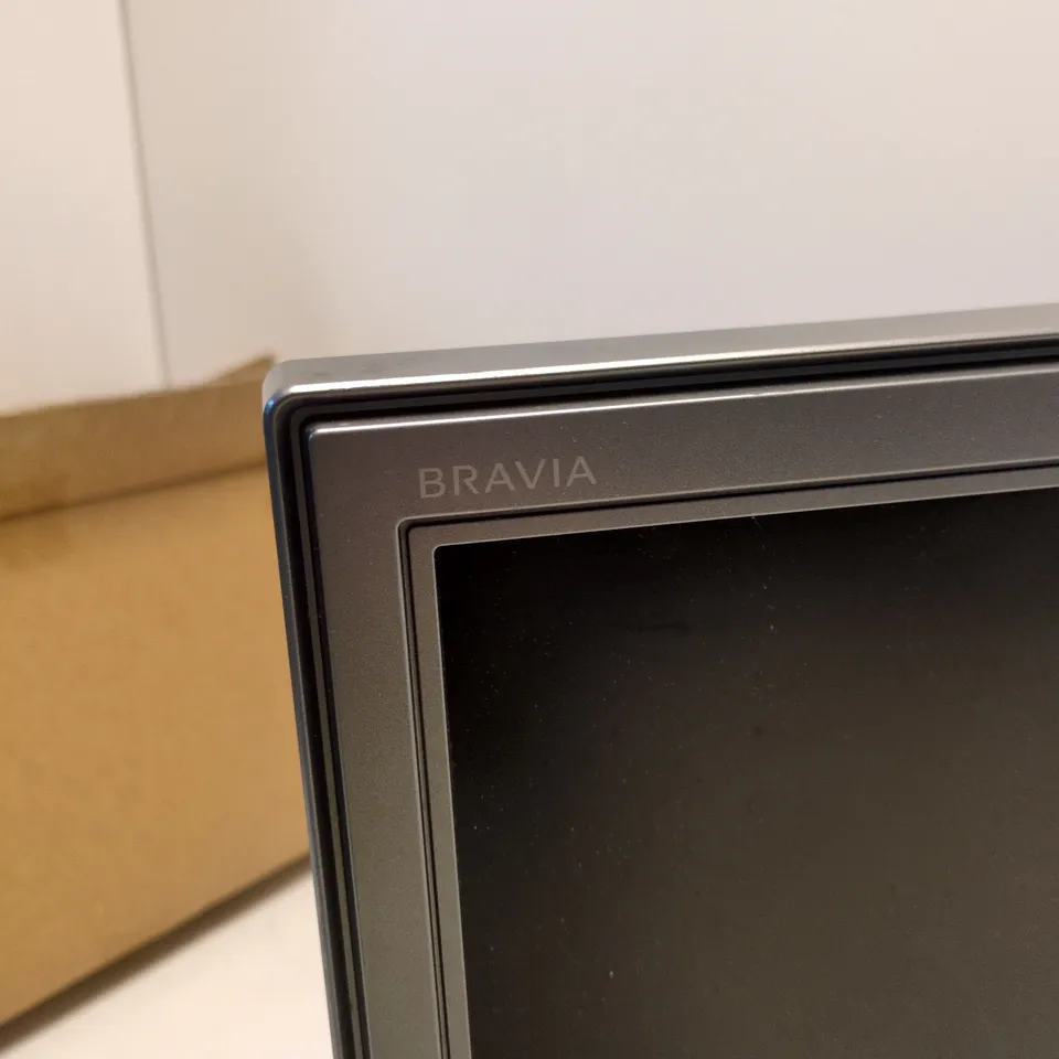 SONY BRAVIA FLAT-SCREEN TV/MONITOR – SILVER FRAME, ON STAND