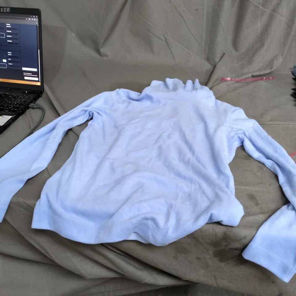 BOX OF APPROXIMATLEY 25 ASSORTED CLOTHING  – LIGHT-BLUE FLEECE TOP + GRAFFITI-PATTERN GARMENT