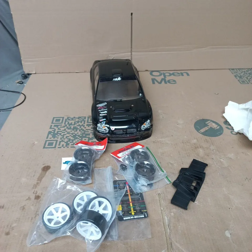 RADIO-CONTROLLED CAR BODY SHELL – BLACK WITH SPARE WHEELS & ACCESSORIES 