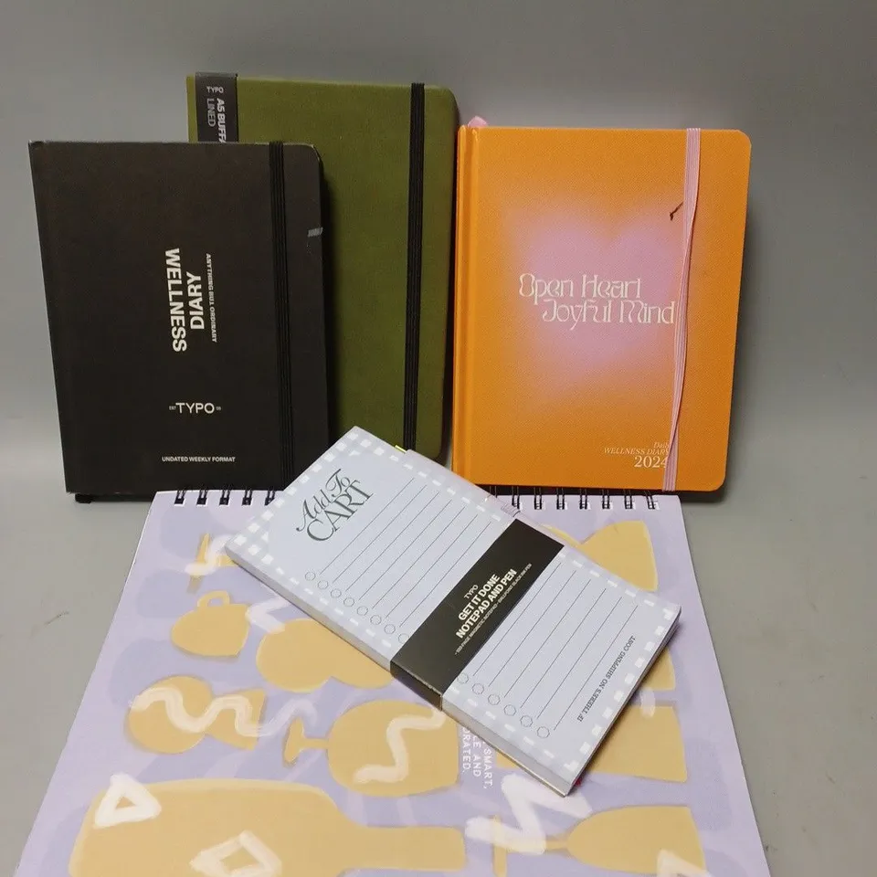 APPROXIMATELY 25 ASSORTED TYPO DIARIES, JOURNALS, NOTEBOOKS TO INCLUDE GARFIELD UNIVERSITY A5 CAMPUS NOTEBOOK, A6 BUFFALO JOURNAL, A4 EVERYDAY NOTEBOOK 