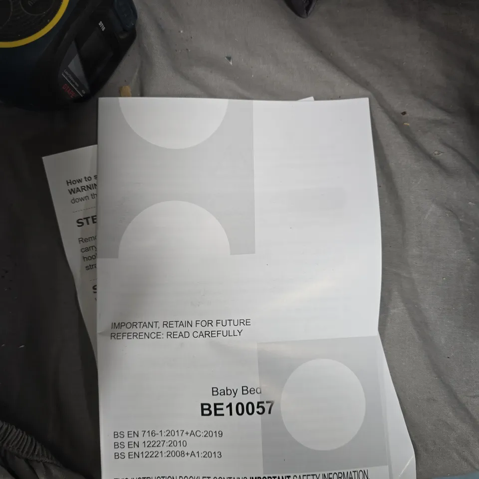 FOLDED BABY BED  INCLUDES BE10057 MANUAL