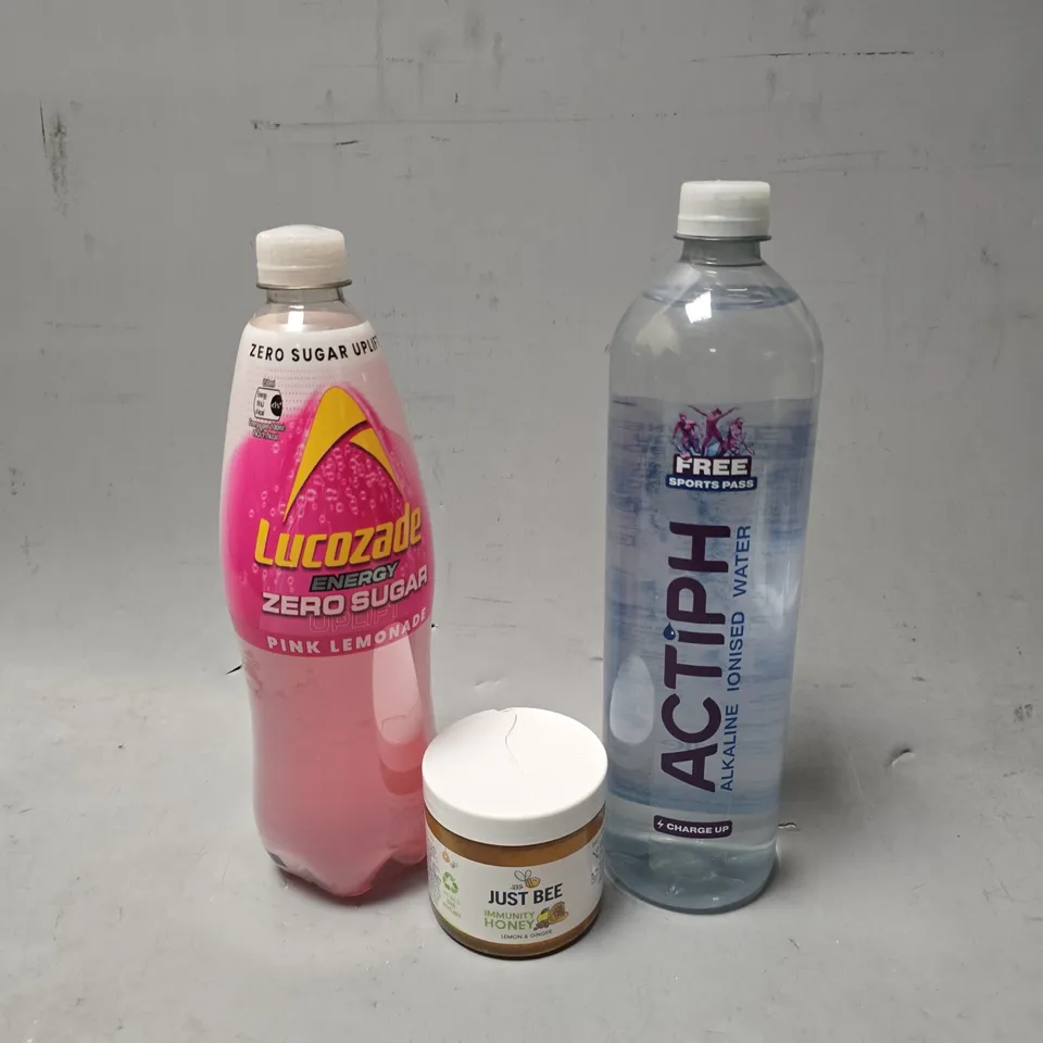 APPROXIMATELY 8 ASSORTED FOOD & DRINK ITEMS TO INCLUDE - JUST BEE HONEY , LUCOZADE PINK LEMONADE , ACTIPH IONISED WATER ETC