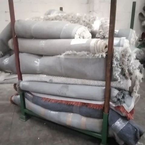 STILLAGE OF APPROXIMATELY 20 DESIGNER RUGS