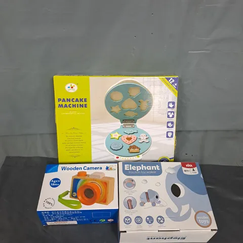 LARGE BOX OF ASSORTED TOY ITEMS TO INCLUDE WOODEN CAMERA, PUL ALONG ELEPHANT AND PANCAKE MACHINE
