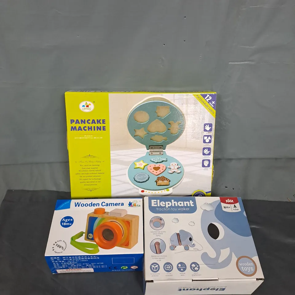 LARGE BOX OF ASSORTED TOY ITEMS TO INCLUDE WOODEN CAMERA, PUL ALONG ELEPHANT AND PANCAKE MACHINE