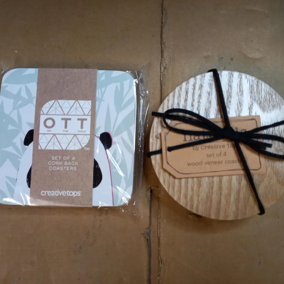BOX OF APPROXIMATELY 50 PACKS OF CREATIVE TOPS COASTERS IN A PANDA & WOODEN VENEER DESIGN 