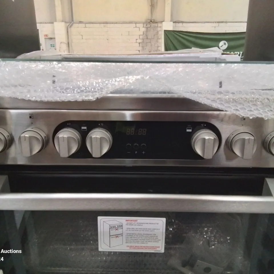HOTPOINT DOUBLE OVEN AND GAS HOBS IN BLACK AND SILVER HANDLES 