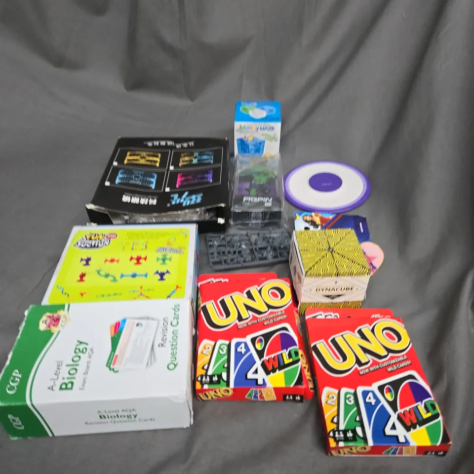 APPROXIMATELY 10 ASSORTED TOYS AND GAMES TO INCLUDE UNO, CARD GAMES AND RUBIKS CUBES