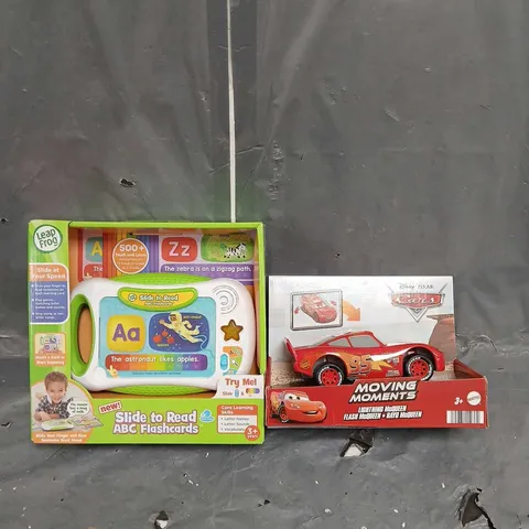 LOT OF 2 ASSORTED TOYS TO INCLUDE - DISNEY CARS MOVING MOMENTS LIGHTENING MQUEEN - LEAP FROG SLIDE TO READ ABC FLASH CARDS