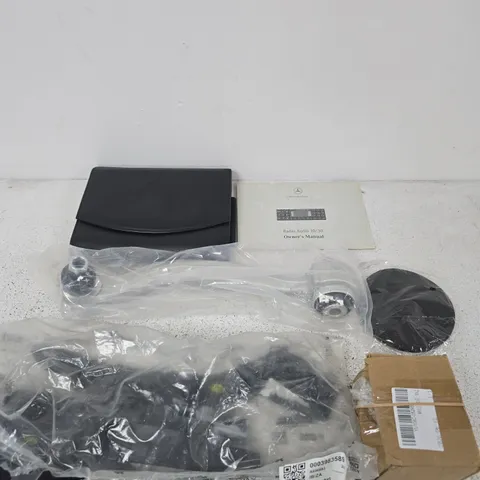 APPROXIMATELY 15 ASSORTED ITEMS INCLUDING REAR BUMPER BRACKET AND A MERCEDES BENZ MANUAL