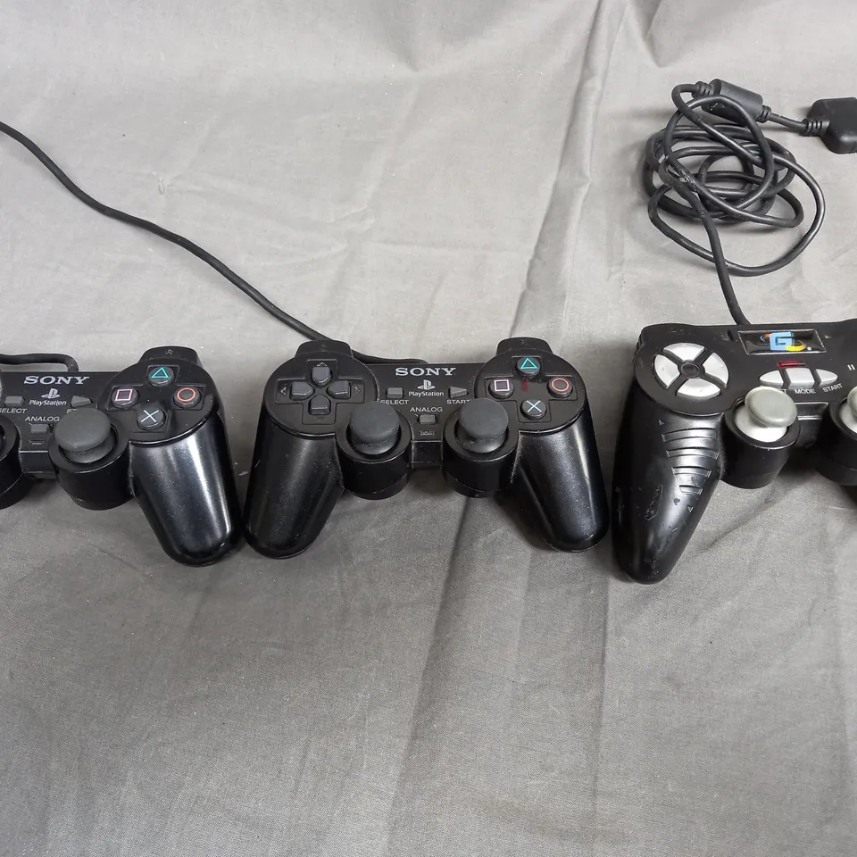 PLAYSTATION 2 GAMES CONSOLE WITH CONTROLLERS AND ASSORTED GAMES TO INCLUDE FIFA 03, TONY HAWKS AND SMACKDOWN VS RAW