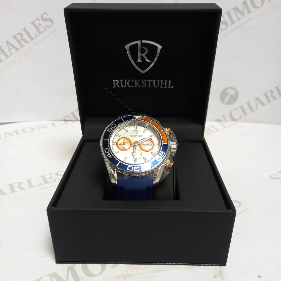 MEN’S RUCKSTUHL CHRONOGRAPH R400 WATCH – SILVER COLOUR CASE – SILVER DIAL – 3ATM WATER RESISTANT – BLUE RUBBER STRAP 