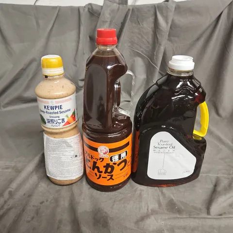 APPROXIMATELY 8 ASSORTED FOOD &DRINK ITEMS TO INCLUDE - BULLDOG TONKATSU SAUCE - KEWPIEDEEP-ROASTED SESAME DRESSING - PURE TOSTED SESAME OIL - COLLECTION ONLY