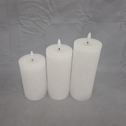 THREE WHITE PILLAR CANDLES – SET OF 3