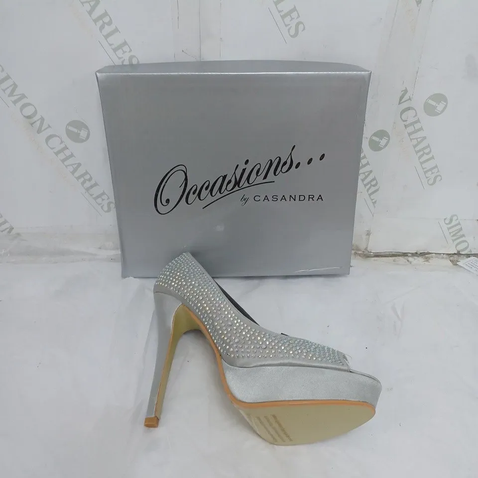 LARGE BOX OF APPROXIMATELY 10 BOXED OCCASIONS BY CASANDRA JEWELLED SILVER OPEN TOE HEELS IN VARIOUS SIZES 