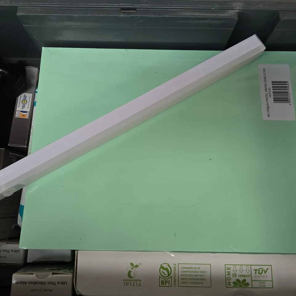 APPROXIMATELY 12 ASSORTED HOUSEHOLD ITEMS TO INCLUDE ULTRA THIN VIBRATION ALARM, A4 PASTEL GREEN, SMALL FOOD SCRAP BAGS, ETC