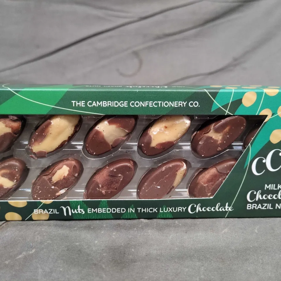 APPROXIMATELY 12 PACKS OF THE CAMBRIDGE CONFECTIONERY CO MILK CHOCOLATE BRAZIL NUTS 120G PER PACK