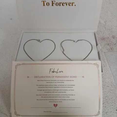 TWO SILVER HEART-SHAPED BRACELETS IN PRESENTATION BOX (BOX SET)