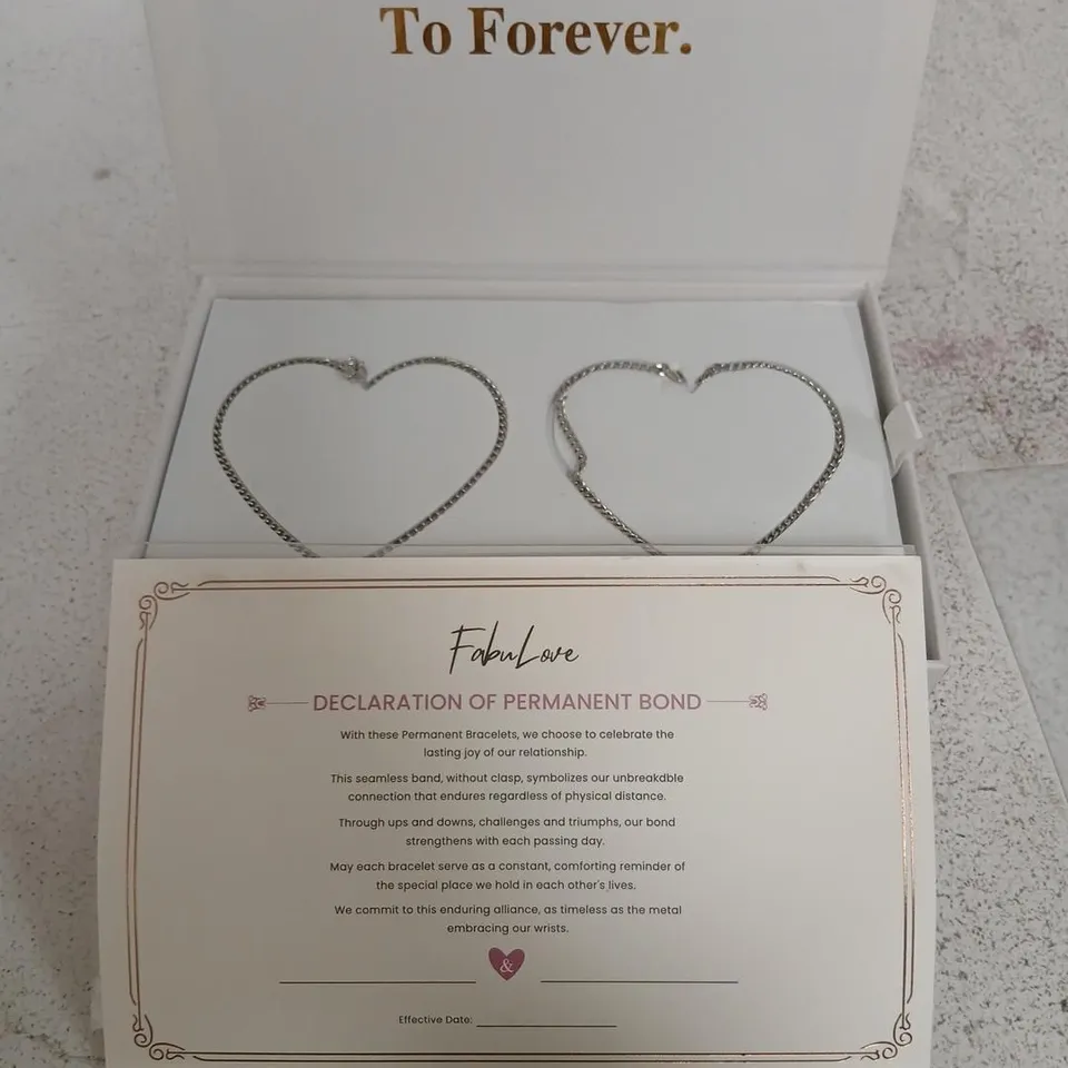 TWO SILVER HEART-SHAPED BRACELETS IN PRESENTATION BOX (BOX SET)