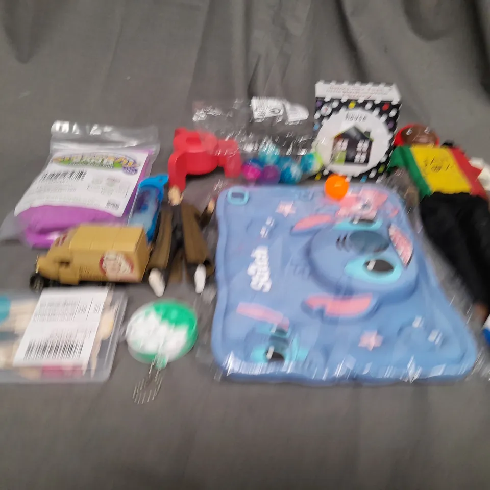 APPROXIMATELY 10 ASSORTED TOYS AND GAMES TO INCLUDE STITCH, BOUNCY BALLS AND CARD GAMES
