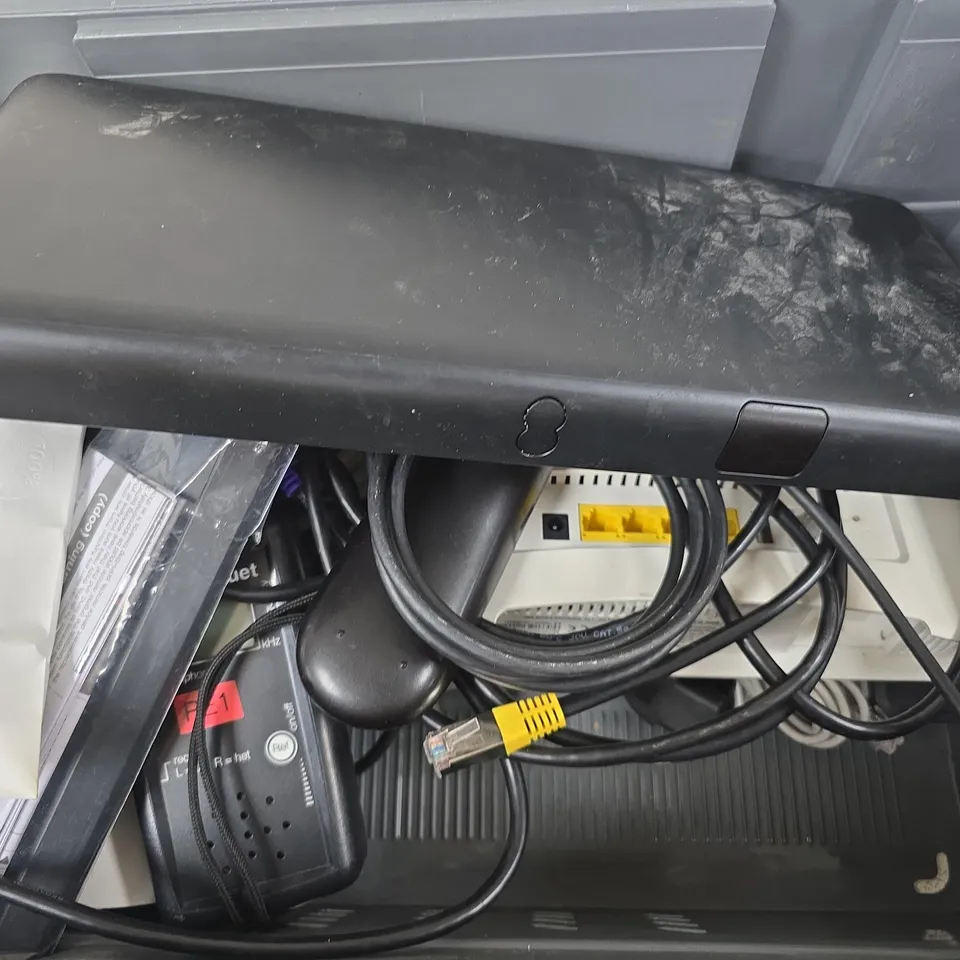 APPROXIMATELY 12 ASSORTED HOUSEHOLD ITEMS TO INCLUDE ROUTERS, CABLES, TV REMOTES, ETC