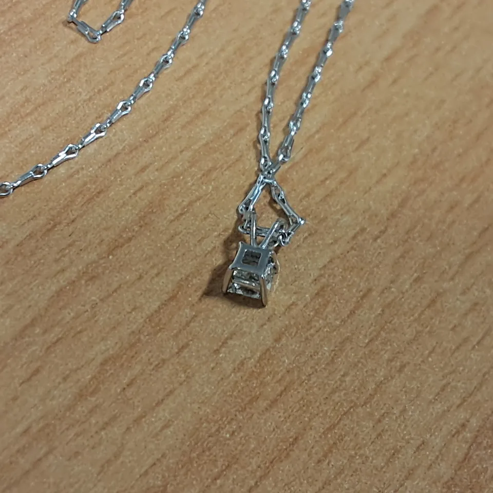 18CT WHITE GOLD PENDANT ON CHAIN SET WITH A NATURAL PRINCESS CUT DIAMOND