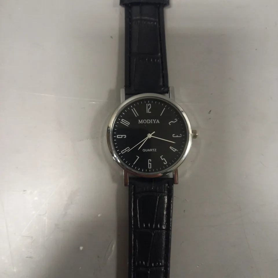 FOUR ASSORTED WATCHES IN VARIOUS STYLES TO INCLUDE MODIYA, AND YAZOLE