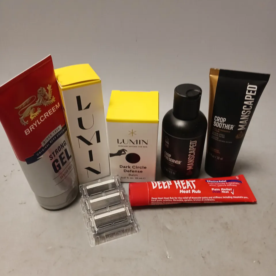 BOX OF APPROXIMATELY 6 COSMETIC ITEMS TO INCLUDE - MANSCAPED CROP PRESERVER - LUMIN DARK CIRCLE DEFENSE - DEEP HEAT RUB - ETC