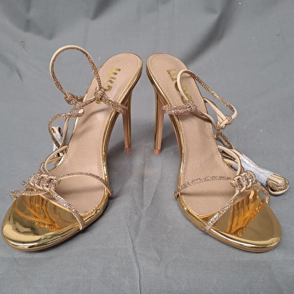 BOXED PAIR OF EGO OPEN TOE STILETTO HEEL STRAPPY SANDALS IN METALLIC GOLD UK SIZE 6