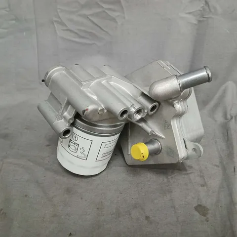 AUTOMOTIVE OIL FILTER HOUSING WITH OIL FILTER (MODEL UNSPECIFIED)