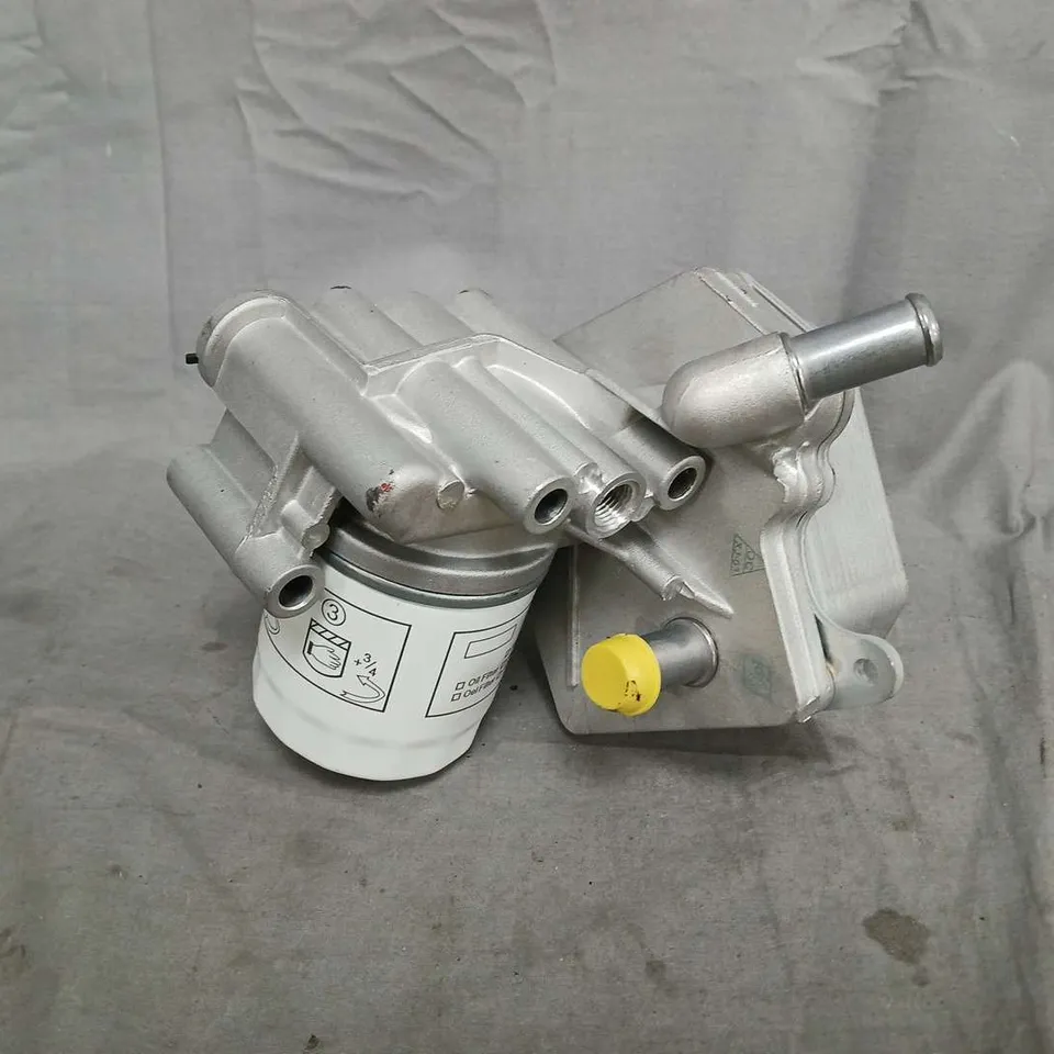 AUTOMOTIVE OIL FILTER HOUSING WITH OIL FILTER (MODEL UNSPECIFIED)