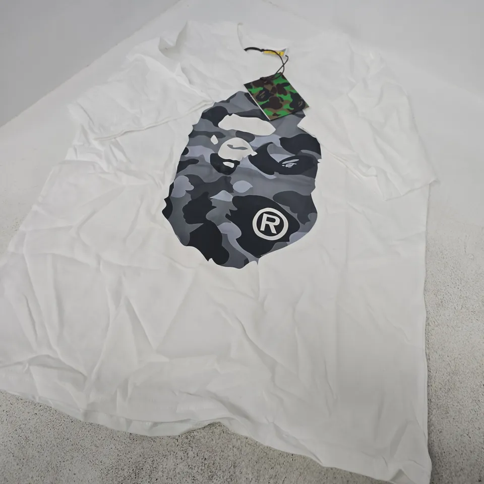 A BATHING APE T-SHIRT – WHITE, CAMOUFLAGE APE LOGO, SIZE L (UK)
