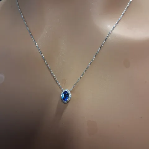 18CT WHITE GOLD PENDANT ON CHAIN, SET WITH AN OVAL CUT SAPPHIRE AND NATURAL DIAMONDS 