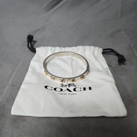 COACH SILVER-TONE BANGLE BRACELET WITH GOLD ACCENT STUDS – NEW YORK