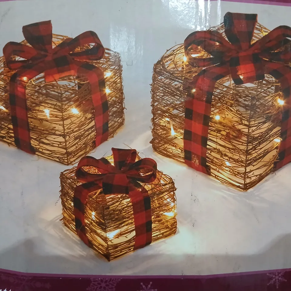 FOUR BOXED SHATCHI SET OF THREE BATTERY OPERATED LED RATTAN GOFT BOXES