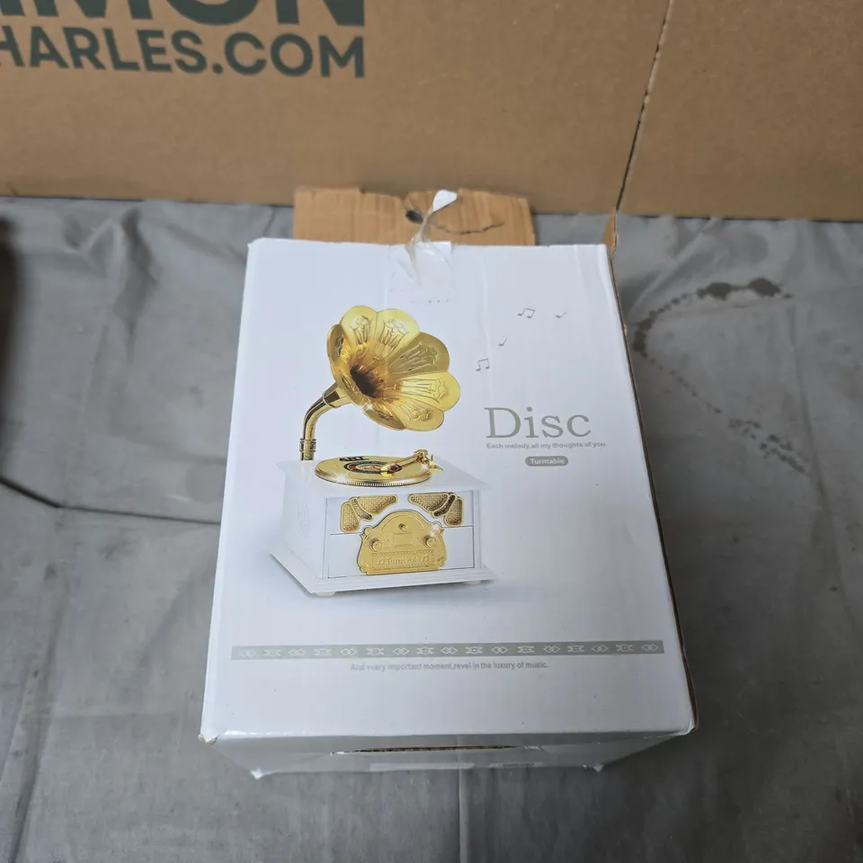BOX OF ASSORTED HOUSEHOLD ITEMS INCLUDING  WHITE BRAIDED-STRAP SANDAL, GROOMING TRIMMER KIT, DECORATIVE GRAMOPHONE MUSIC BOX, AND PACKAGED BEDDING